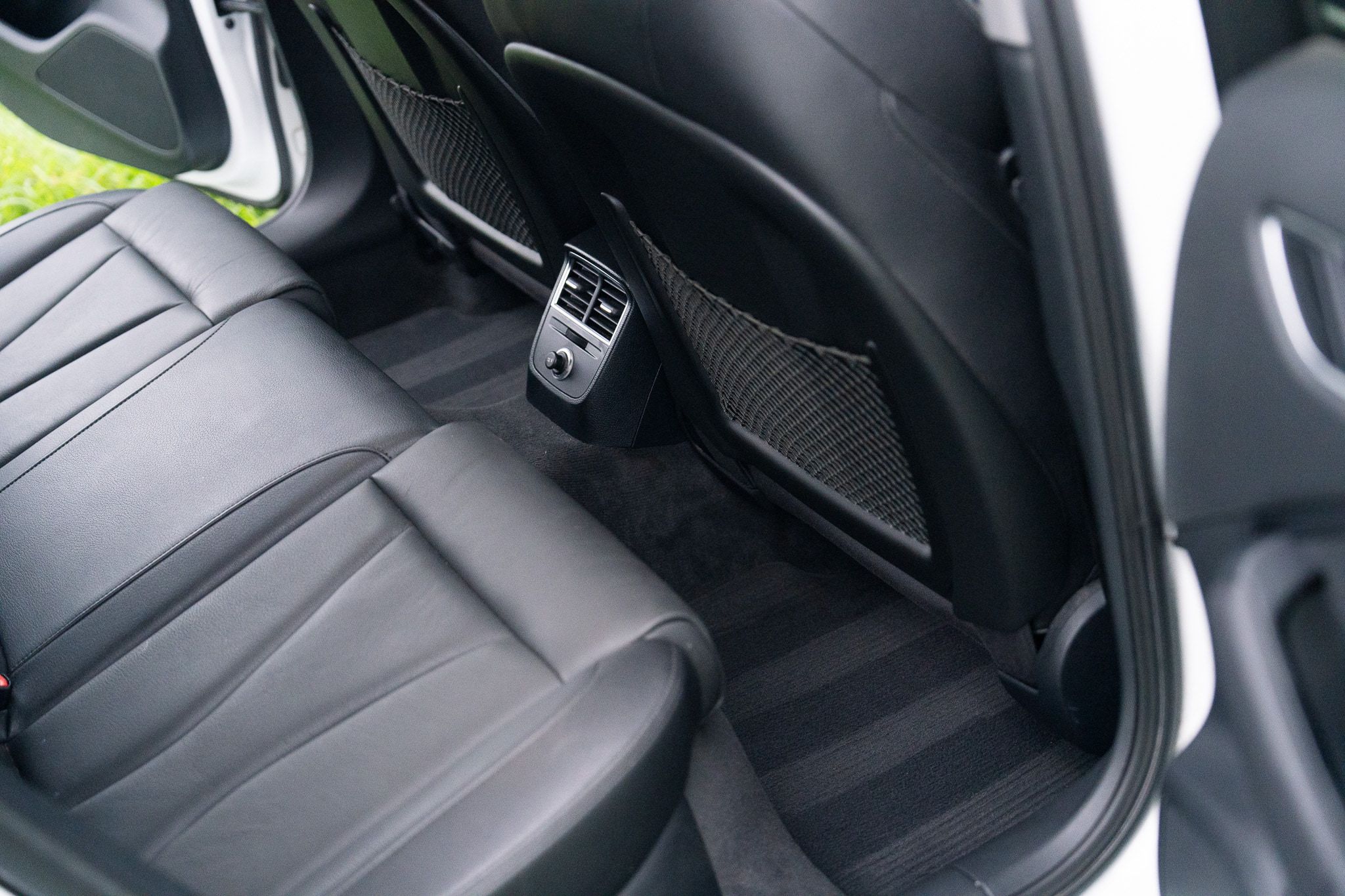 Rear seats and carpet with fresh extraction lines after a Premium interior detail